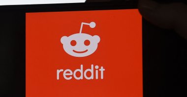 The logo of social media platform Reddit on a mobile phone in Arlington, Virginia, Jan. 29, 2021. (AFP Photo)
