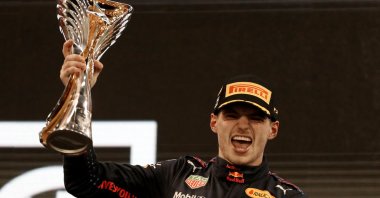 Red Bull's Max Verstappen celebrates winning the Abu Dhabi F1 GP and the 2021 world championship, Abu Dhabi, UAE, Dec. 12, 2021. (AFP Photo)