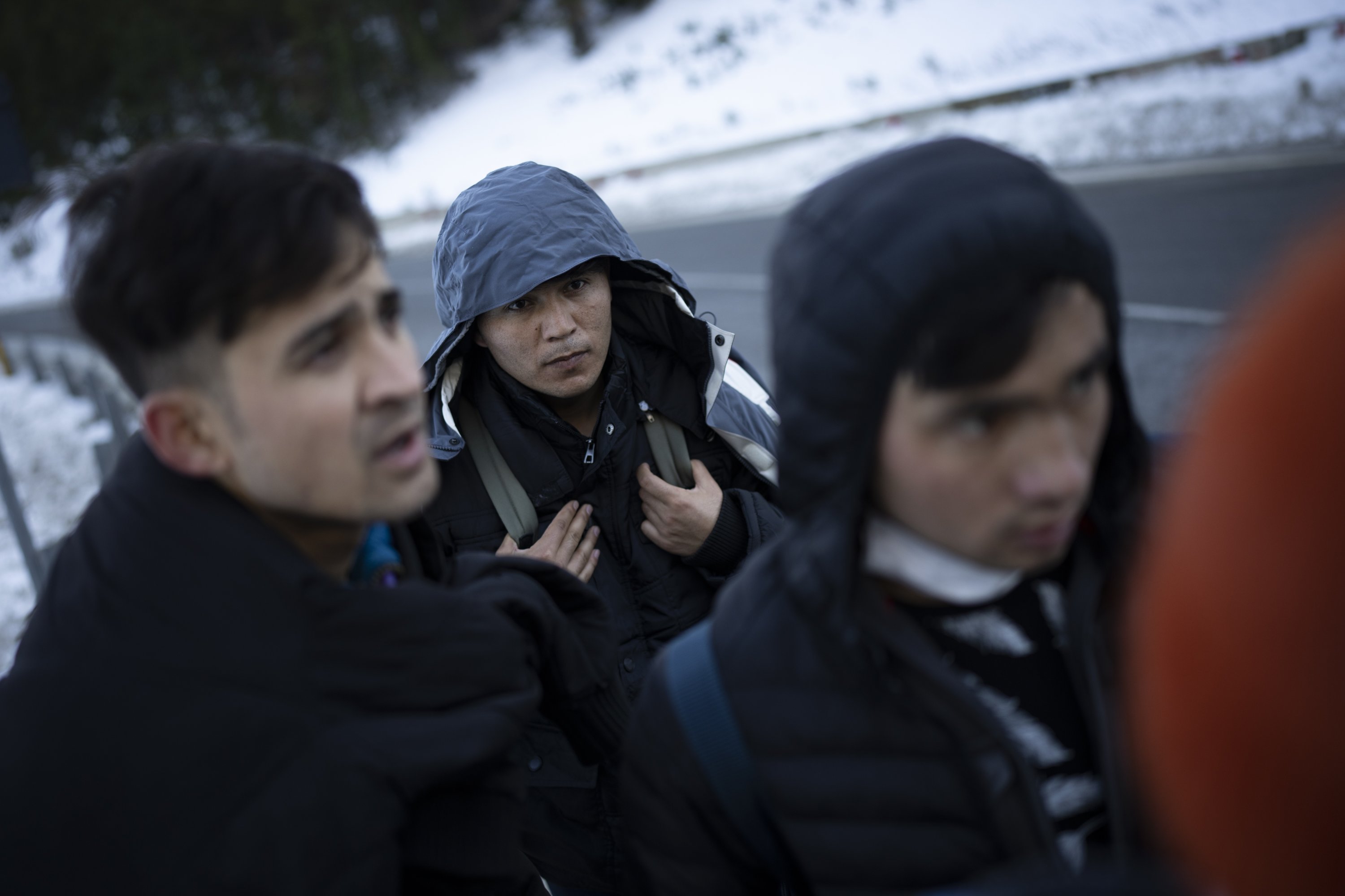 Afghan migrants headed to France from Italy walk along a mountain road leading to the French-Italian border, Dec. 15, 2021. (AP Photo)