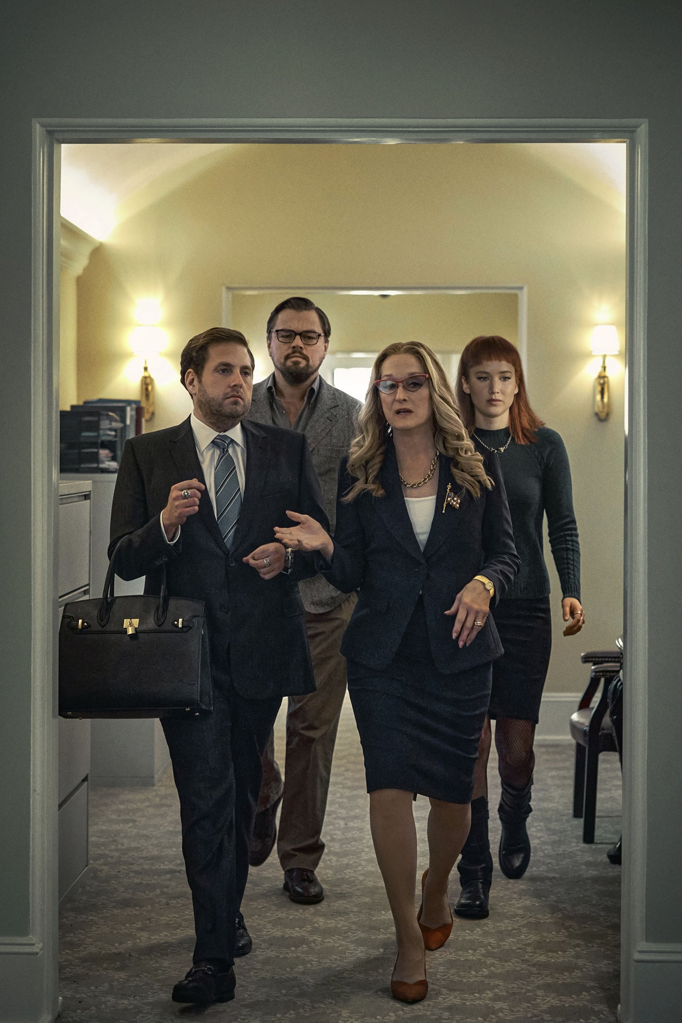 Jonah Hill (L) as Jason Orlean, Leonardo DiCaprio (C-L) as Dr. Randall Mindy, Meryl Streep (C-R) as President Janie Orlean and Jennifer Lawrence as Kate Dibiasky, in a scene from the film “Don't Look Up.” (Netflix via AP)