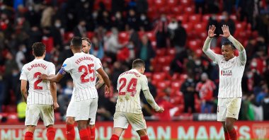 Sevilla's players celebrate after winning the match against Athletic Club Bilbao, in Bilbao, Spain, Dec. 11, 2021. (AFP PHOTO) 