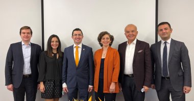 RS Research co-founders Rana Sanyal (3rd R) and Sena Nomak (3rd L) pose in this undated file photo. 