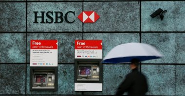 A man walks past an HSBC bank branch in London, Britain, Nov. 12, 2014. (Reuters Photo)