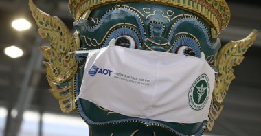 A large Ramayana giant guardian statue wearing a face mask as part of a campaign to prevent the spread of COVID-19 at Suvarnabhumi International Airport in Samut Prakan, Thailand, Dec. 17, 2021. (EPA Photo)