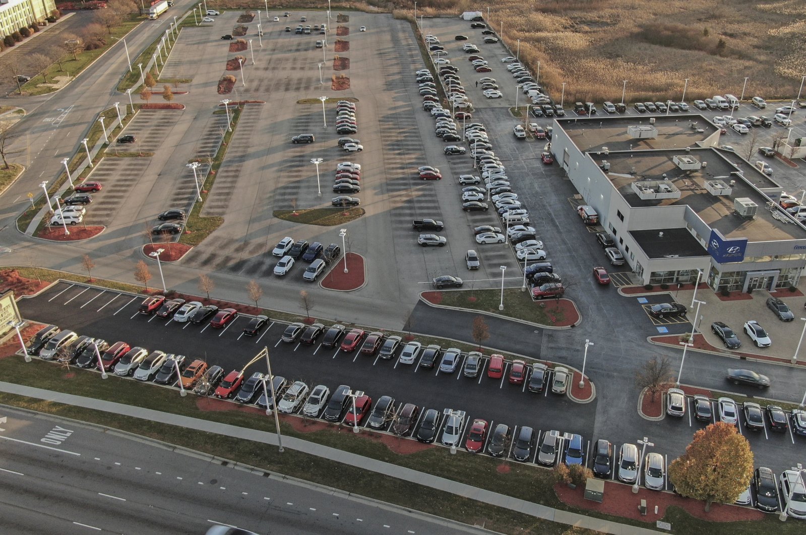 An aerial photo using a drone show preowned vehicles in parking spots usually occupied by new vehicles as new vehicle production levels worldwide remain low in Gurnee, Illinois, U.S., Nov. 30, 2021. (EPA Photo)