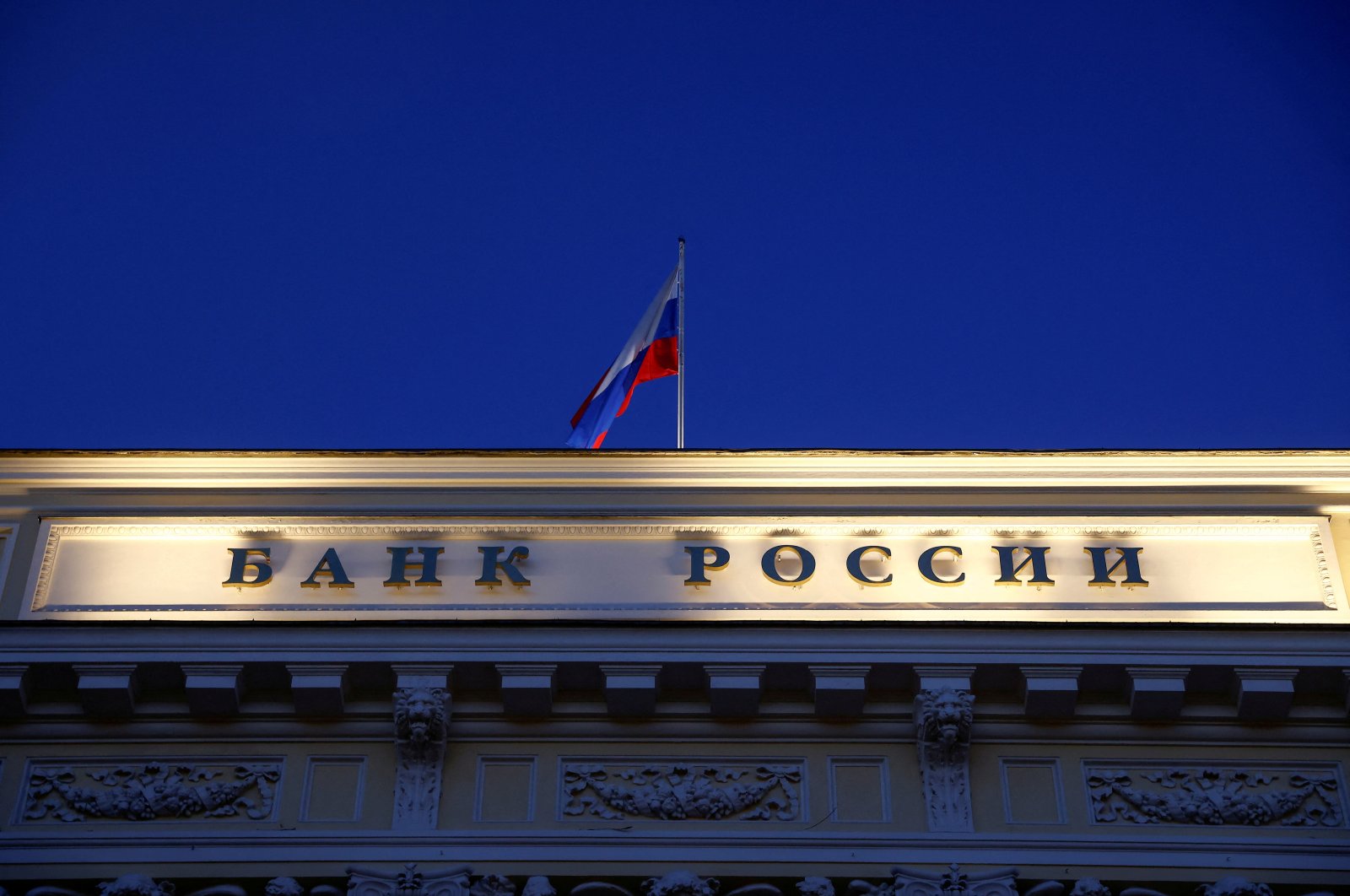 A Russian state flag flies over the Central Bank headquarters in Moscow, Russia, March 29, 2021. (Reuters Photo)