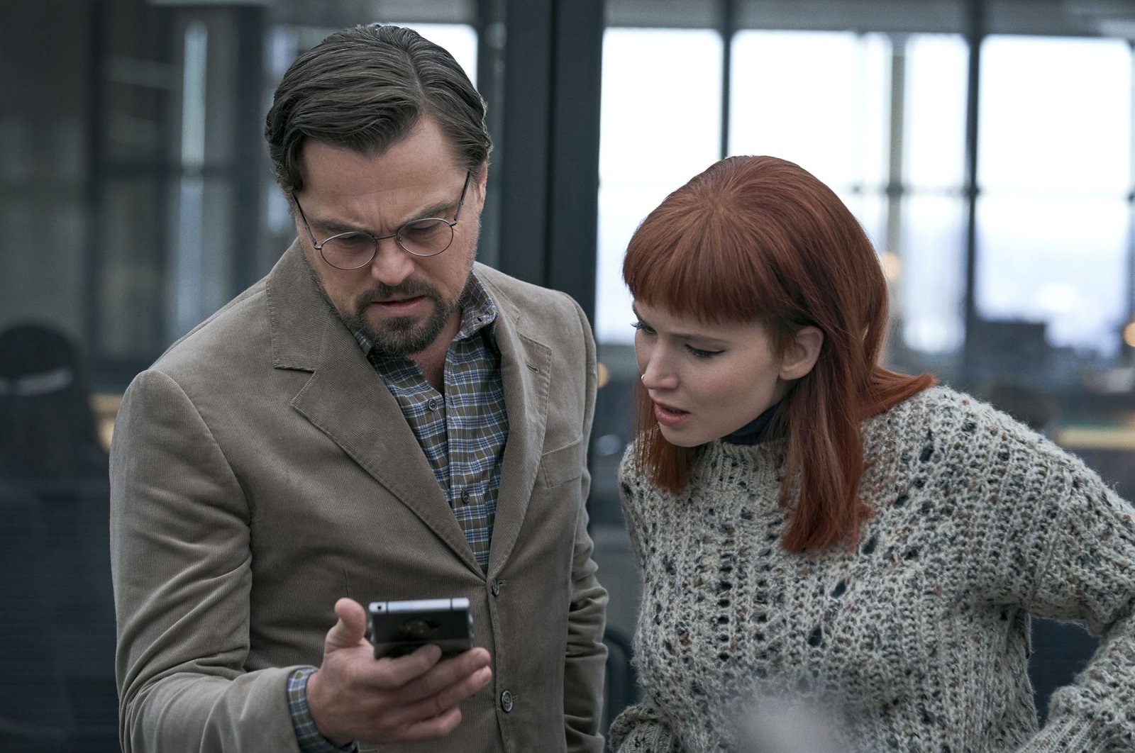 Leonardo DiCaprio (L) as Dr. Randall Mindy and Jennifer Lawrence as Kate Dibiasky, in a scene from the film “Don&#039;t Look Up.” (Netflix via AP)
