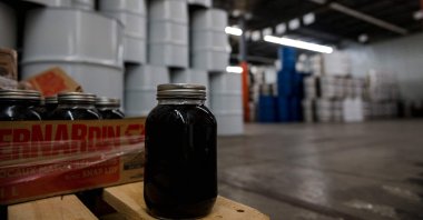A mason jar of maple syrup is pictured at one of two maple syrup reserves at the Quebec Maple Syrup Producers storage facility, Laurierville, Quebec, Canada, Dec. 9, 2021. (AFP Photo)