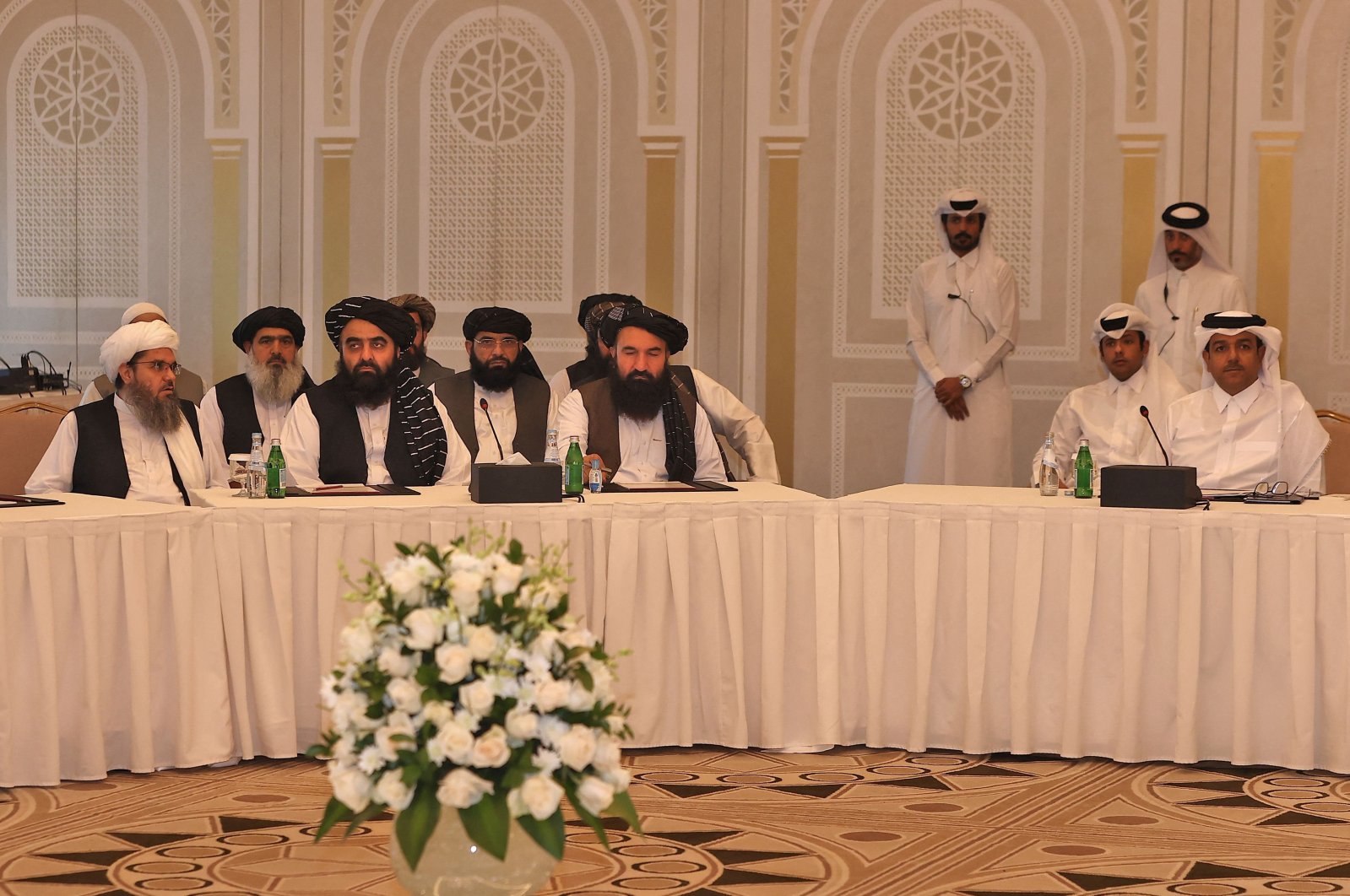 Members of the Taliban delegation Shahabuddin Delawar (L), Amir Khan Muttaqi and Khairullah Khairkhwa (C) meet with foreign diplomats in Qatar&#039;s capital Doha, Oct. 12, 2021. (AFP Photo)