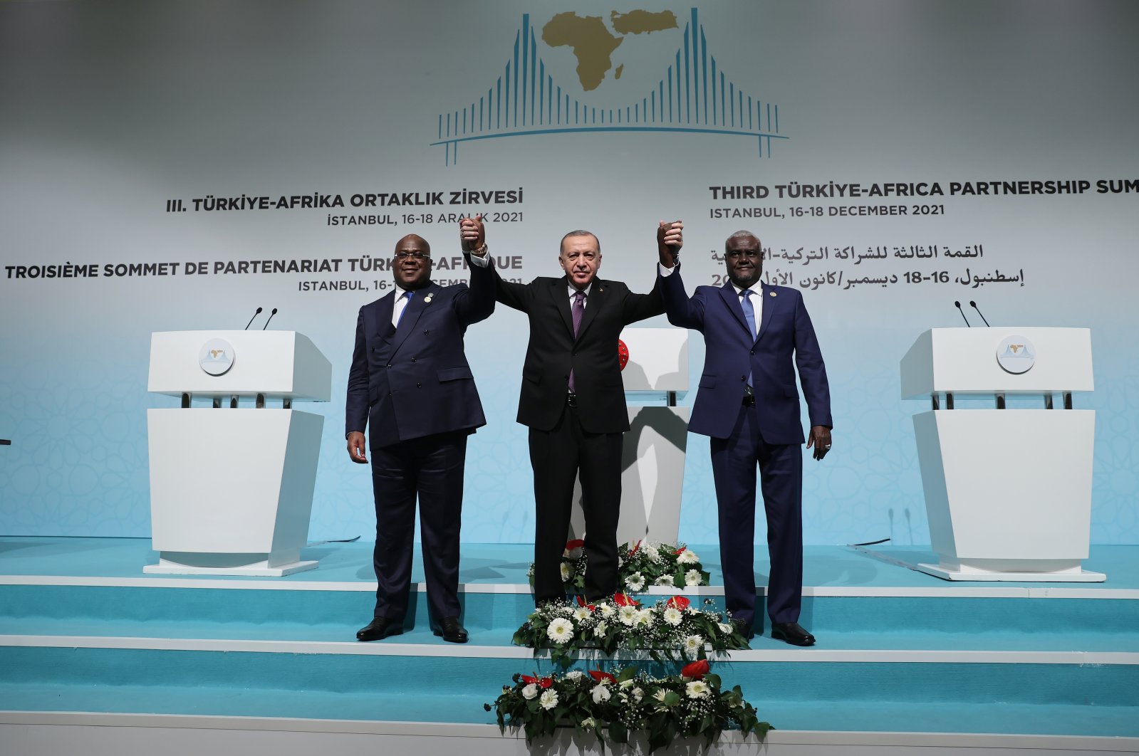President Recep Tayyip Erdoğan (C), his Republic of Democratic Congo counterpart Felix Tshisekedi (L) and the Chairperson of the African Union Commission, Moussa Faki Mahamat pose for a picture after the press conference during the the third Turkey-Africa Partnership Summit in Istanbul on Dec. 19, 2021 (AA Photo)