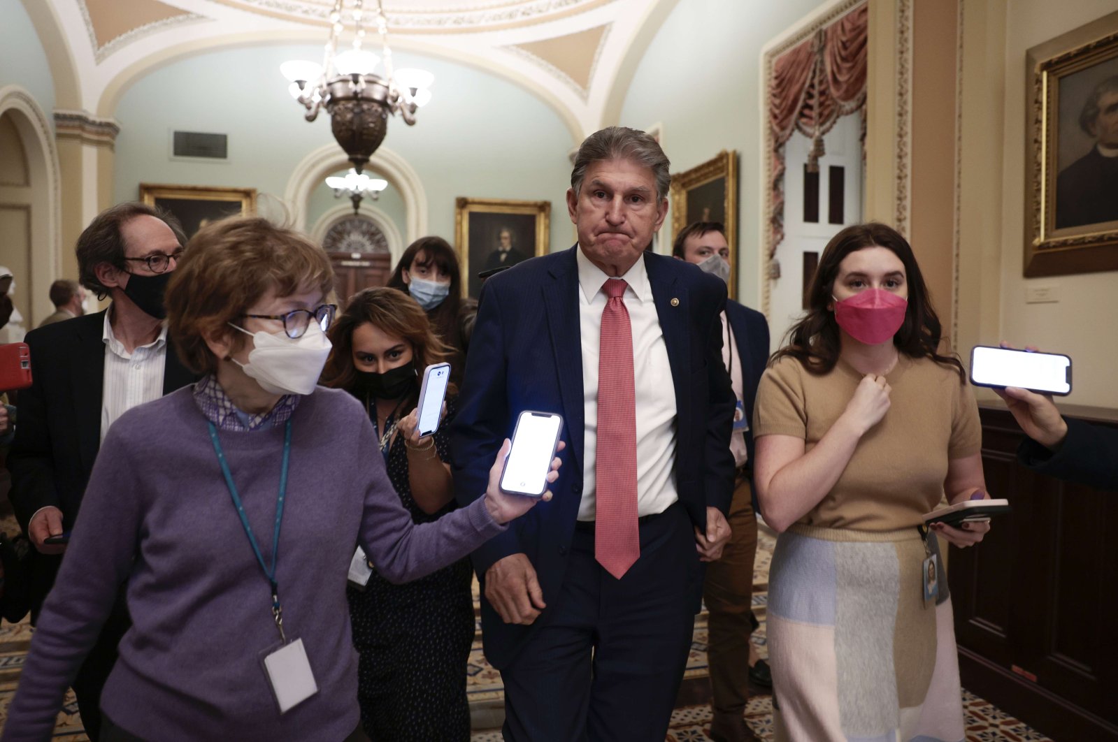 Sen. Joe Manchin (D-WV) is followed by reporters as he leaves a caucus meeting with Senate Democrats at the U.S. Capitol Building in Washington, DC, U.S., on Dec. 17, 2021. (Getty Images / AFP)