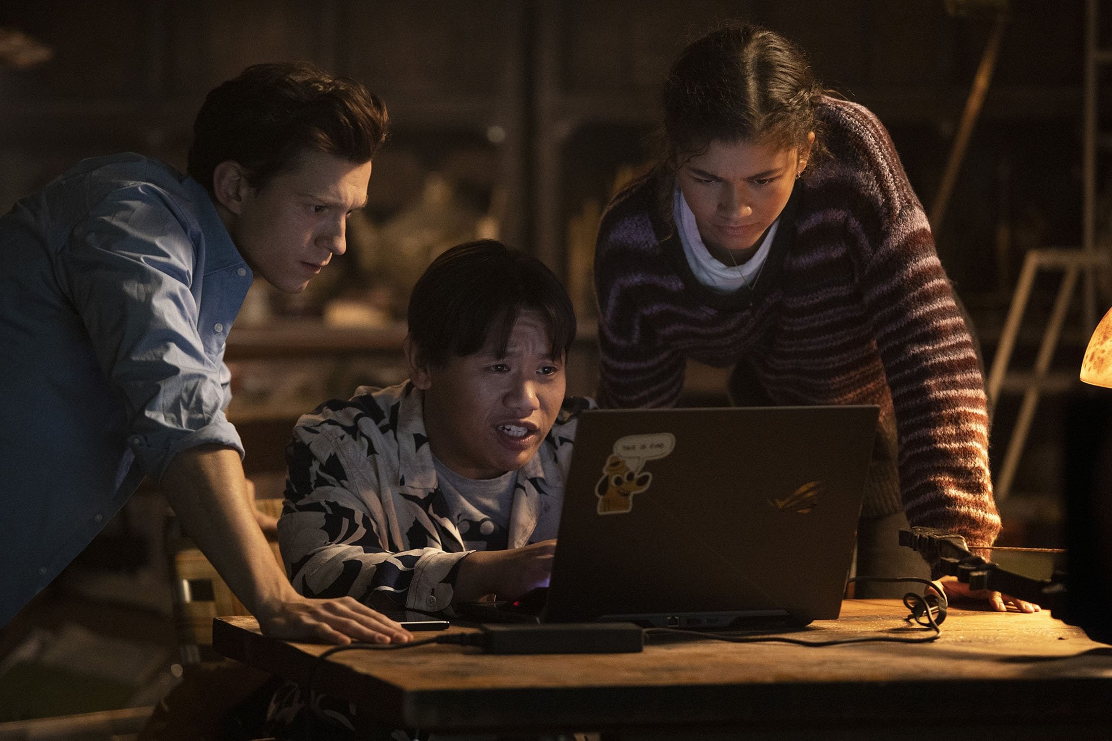 Tom Holland (L), Jacob Batalon (C) and Zendaya, in a scene from the film “Spider-Man: No Way Home.” (Sony Pictures via AP)