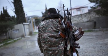 An Armenian soldier carries weapons in Tartar, occupied Nagorno-Karabakh, April 4, 2016. (Reuters File Photo)