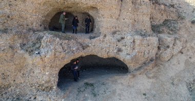 Remains of pots, pans discovered in a three-room area carved into the bedrock in an area overlooking the Van lake. (AA Photo)