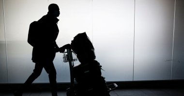 A man walks with his luggage at Fiumicino Airport amid the coronavirus pandemic, near Rome, Italy, May 17, 2021. (Reuters Photo)