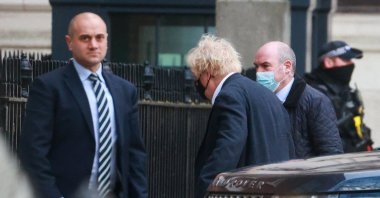British Prime Minister Boris Johnson walks outside a back entrance of 10 Downing Street in London, Britain, Dec. 20, 2021. (Reuters Photo)