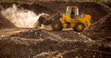 A front loader transports organic waste in the Elephant Vert factory in the "Agropolis" industrial zone in the northern city of Meknes, Morocco, Dec. 9, 2021. (AFP Photo)