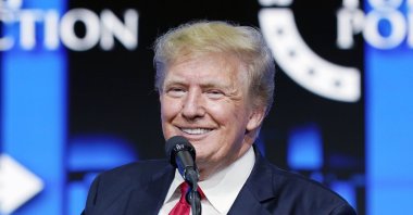 Former President Donald Trump smiles as he pauses while speaking to supporters at a Turning Point Action gathering in Phoenix, Arizona, the U.S., July 24, 2021 (AP File Photo)