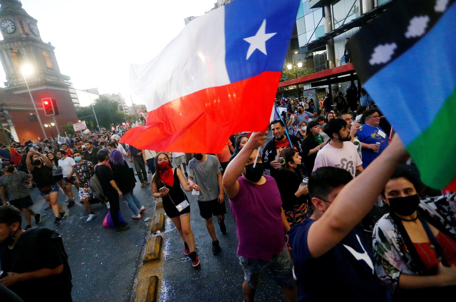 People celebrate the victory of presidential candidate Gabriel Boric in the Plaza de la Dignidad, formerly Plaza Italia, in Santiago, Chile, Dec. 19, 2021. (EPA Photo)