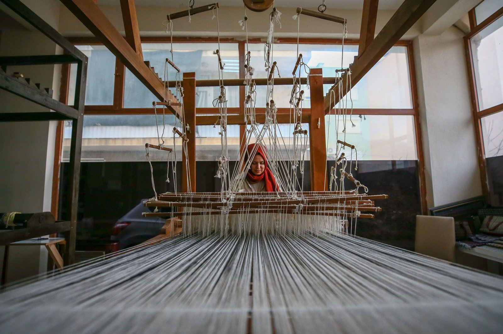 Nurefşan Yaykal keeps the traditional Beledi weaving method alive in her workshop, in Tire district of Izmir, Turkey, Dec. 14, 2021. (AA Photo)