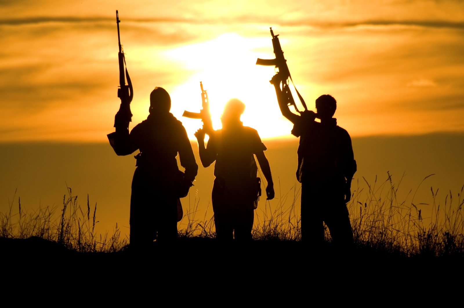 An illustration of silhouettes of several terrorists in a reference to the PKK terrorists. (Photo by Shutterstock)