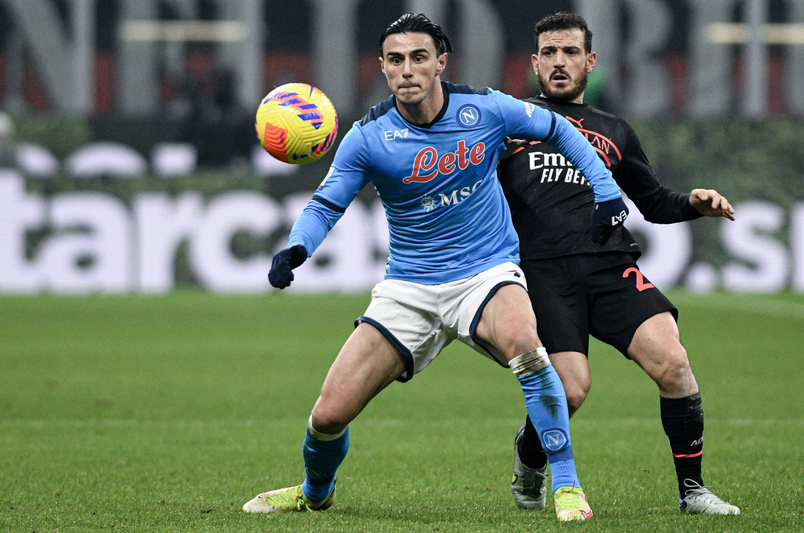Napoli&#039;s Eljif Elmas (L) vies with Milan&#039;s Alessandro Florenzi during a Serie A match, Milan, Italy, Dec. 19, 2021. (AA Photo)


  ( Piero Cruciatti - Anadolu Ajansı )