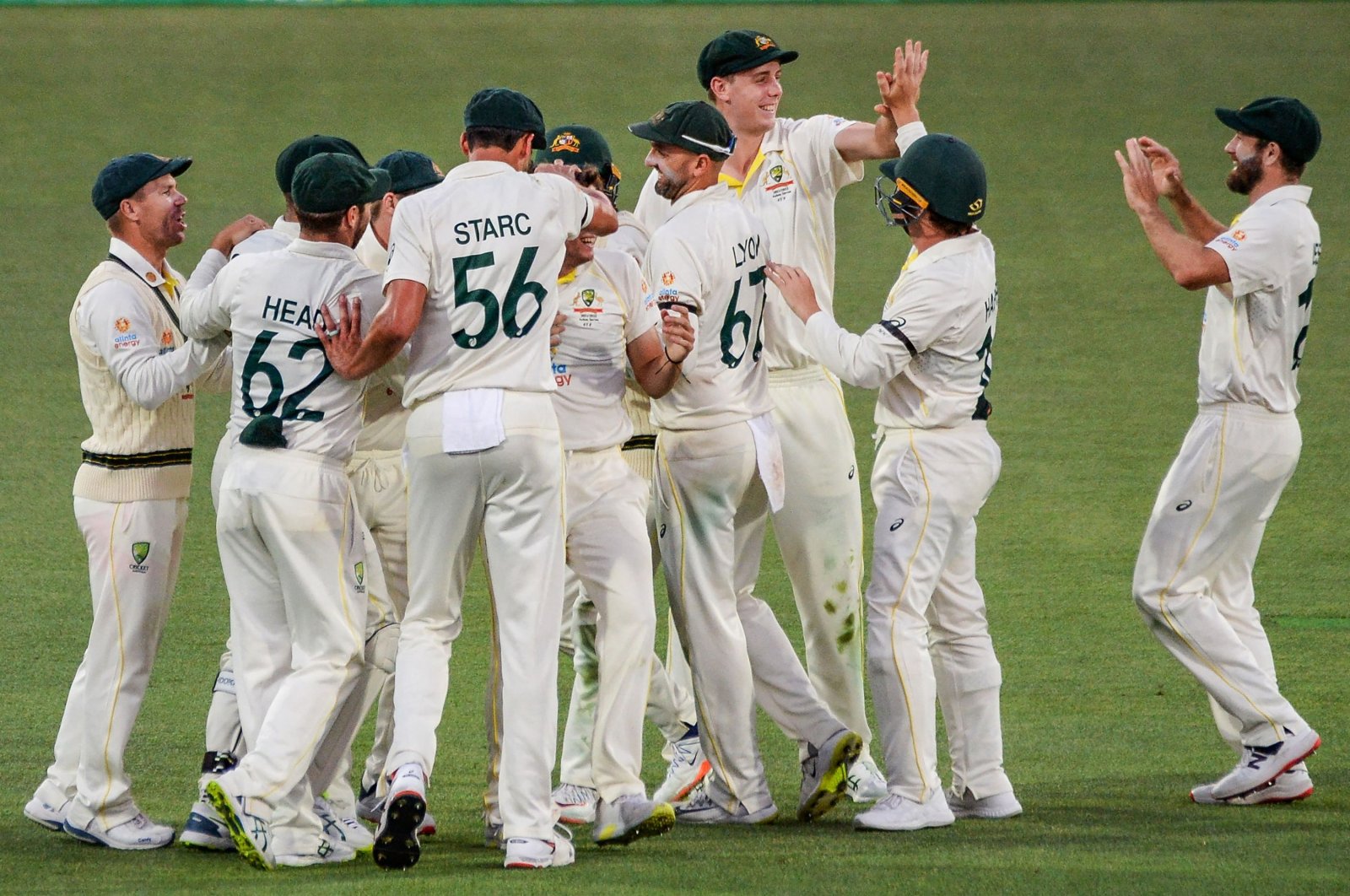 Australian players celebrate their win over England in the second Test in Adelaide, Australia, Dec. 20, 2021. (AFP Photo)