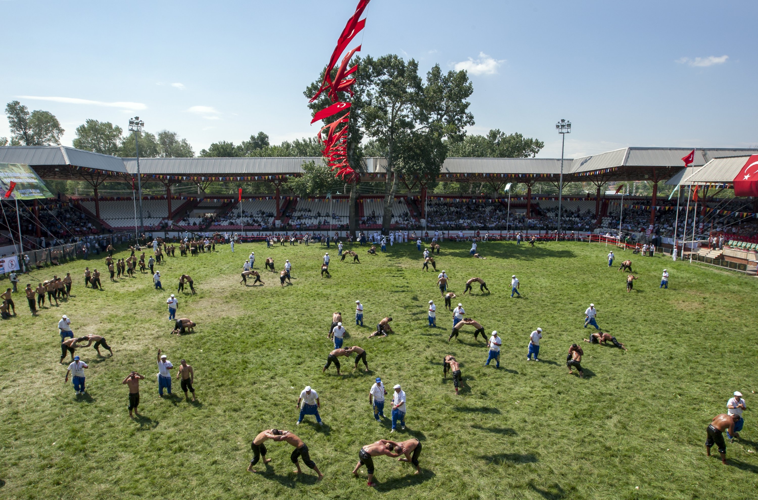 Wrestlers fill the arena at the Kırkpınar Oil Wrestling Festival in Edirne, Turkey. (Shutterstock Photo)