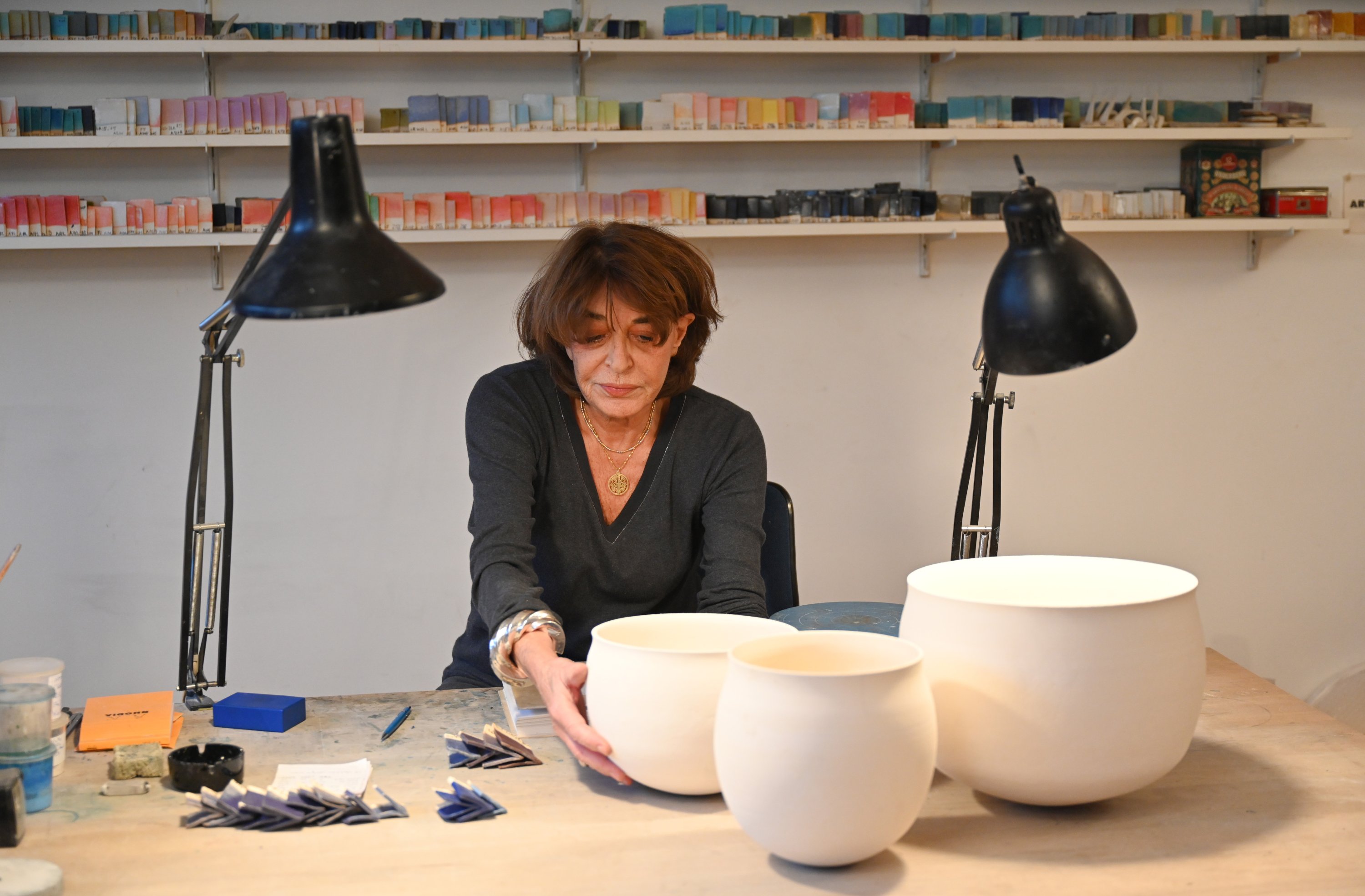 Alev Ebüzziya works in her workshop in Paris, France, Dec.15, 2021. (AA Photo)