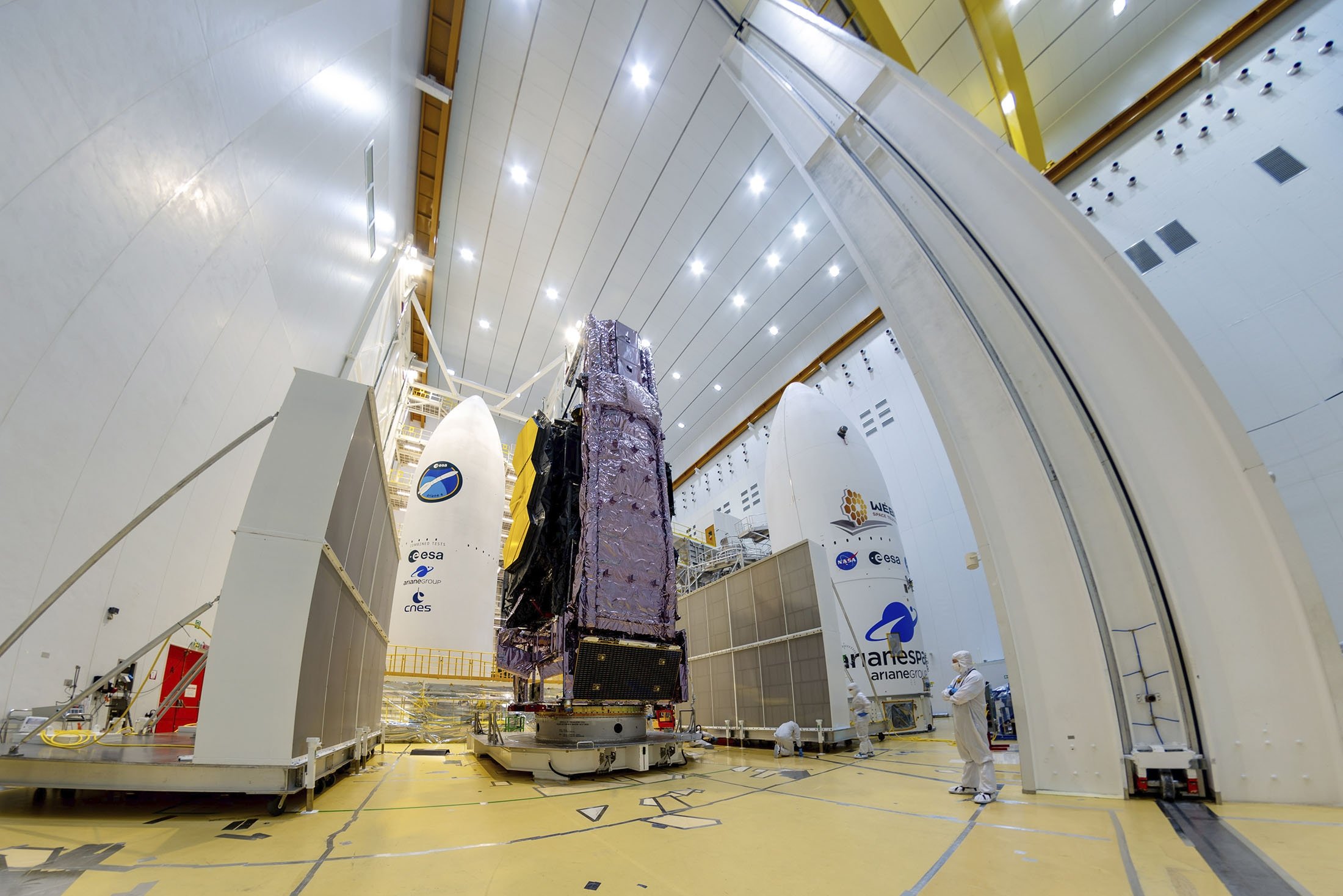 The NASA James Webb Space Telescope is mounted on top of the Ariane 5 rocket that will launch it from Europe's Spaceport in French Guiana, Dec. 11, 2021. (ESA via AP)