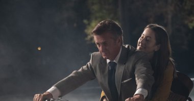 This image released by MGM shows Sean Penn and Alana Haim in a scene from &quot;Licorice Pizza.&quot; (AP)