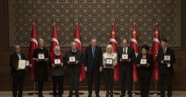 President Recep Tayyip Erdoğan (C) poses with the 2021 Presidential Culture and Arts Grand Awards recipients, Presidential Complex, Ankara, Turkey, Dec. 21, 2021. (AA)