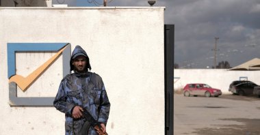 A security officer stands in front of the High National Election Commission building in Benghazi, Libya, Dec. 16, 2021. (REUTERS Photo)