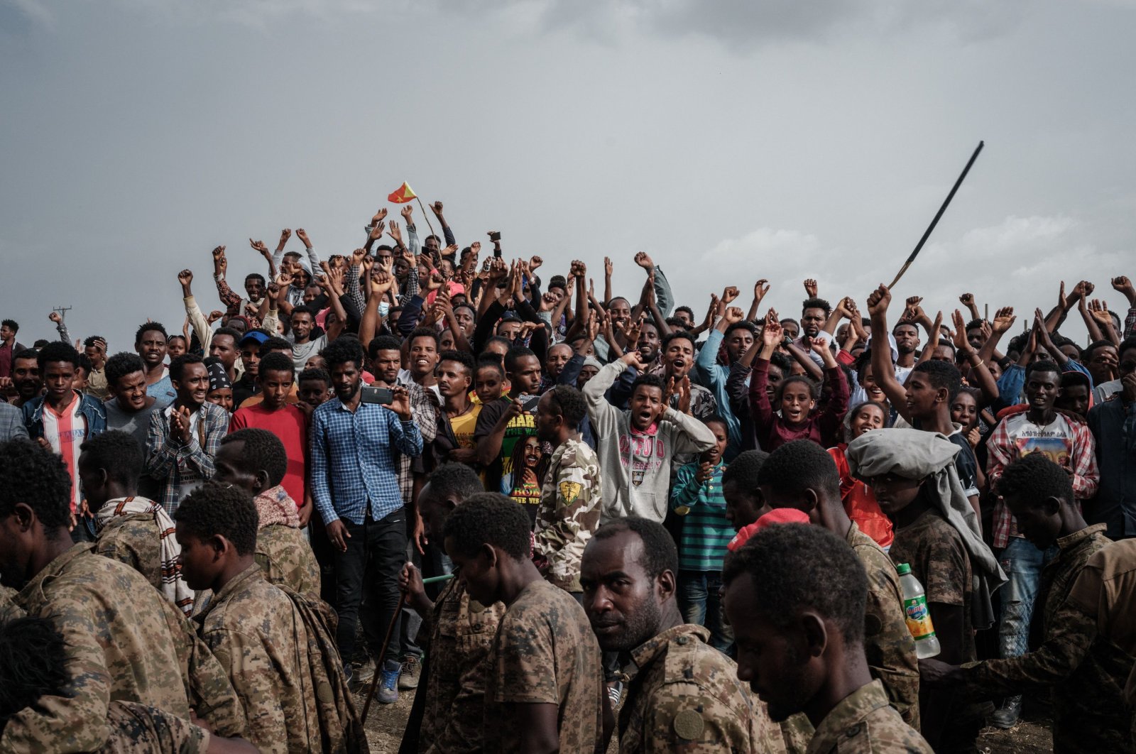 People react as captive Ethiopian soldiers walk towards Mekele Rehabilitation Center in Mekele, the capital of Tigray region, Ethiopia, on July 2, 2021. (AFP Photo)