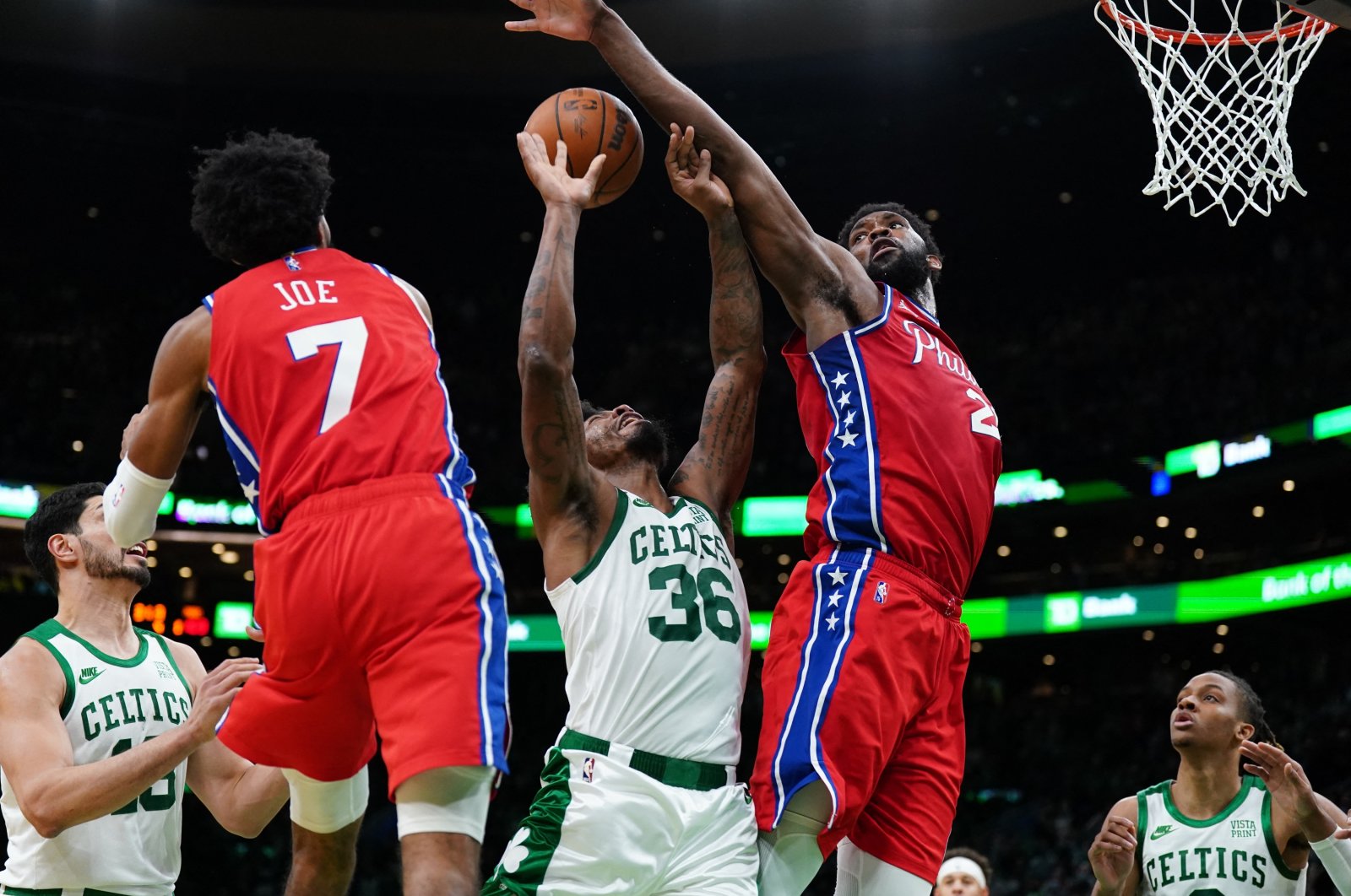 Philadelphia 76ers center Joel Embiid (R) defends against Boston Celtics guard Marcus Smart (L) in an NBA game at TD Garden, Boston, Massachusetts, U.S., Dec 20, 2021. (Reuters Photo)