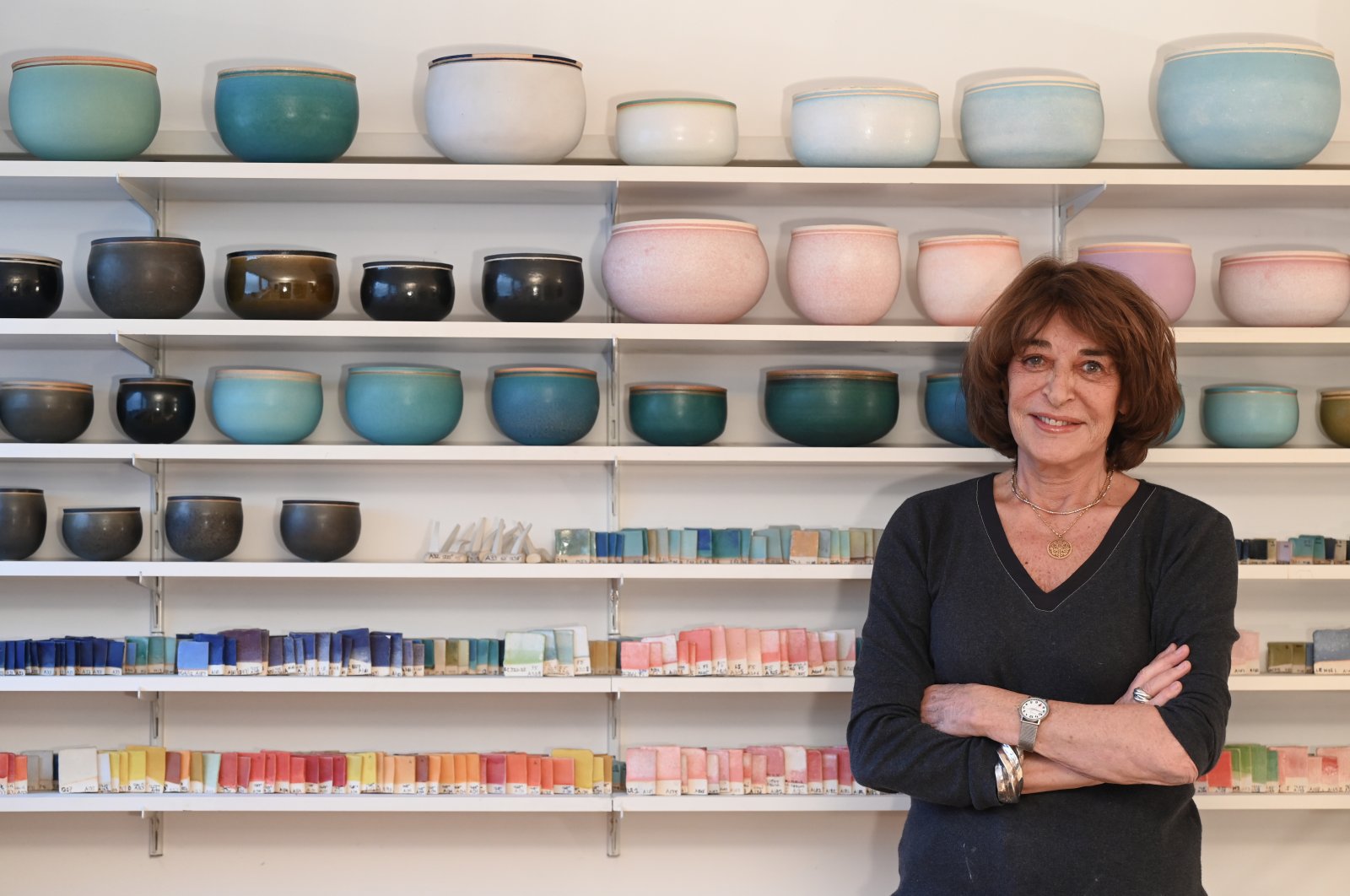 Alev Ebüzziya poses in front of her vessels in her workshop in Paris, France, Dec.15, 2021. (AA Photo)