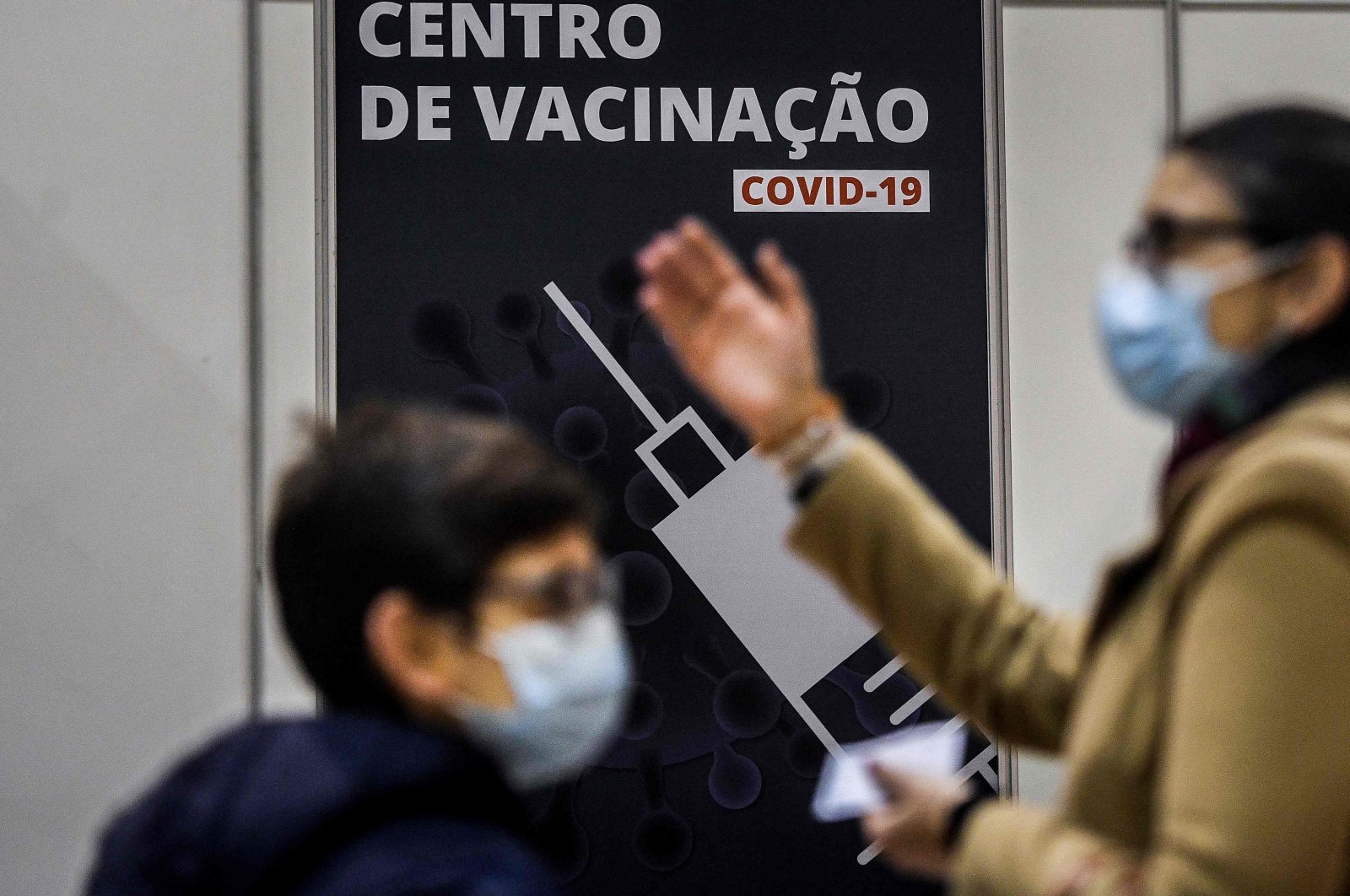 Children accompanied by their parents wait to receive a dose of the COVID-19 vaccine at the vaccination center of Parque das Nacoes in Lisbon on Dec. 18, 2021. (AFP Photo)