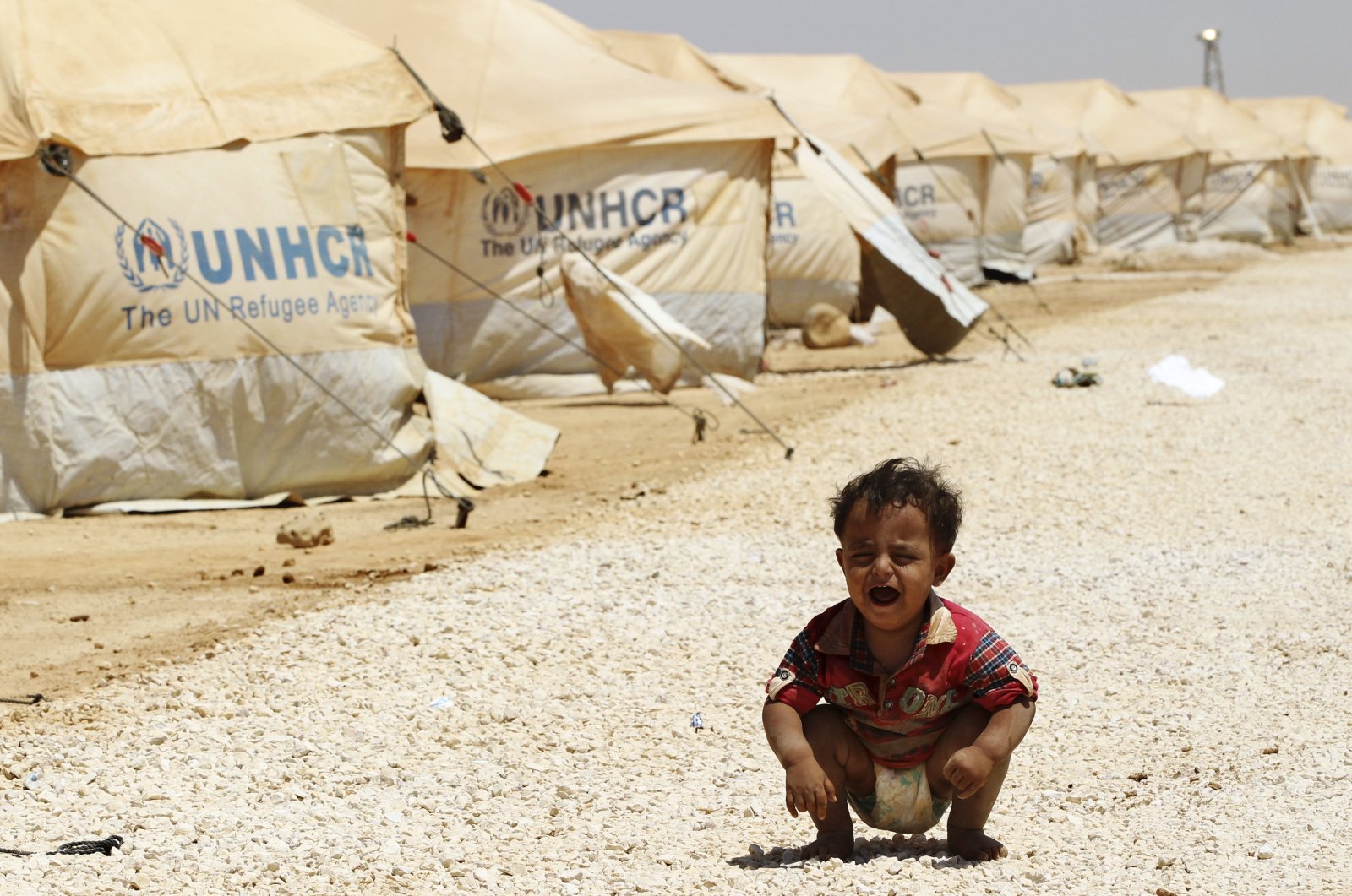 A Syrian refugee child cries at the Al Zaatri refugee camp in the Jordanian city of Mafraq, near the border with Syria, Aug. 3, 2012. (Reuters File Photo)
