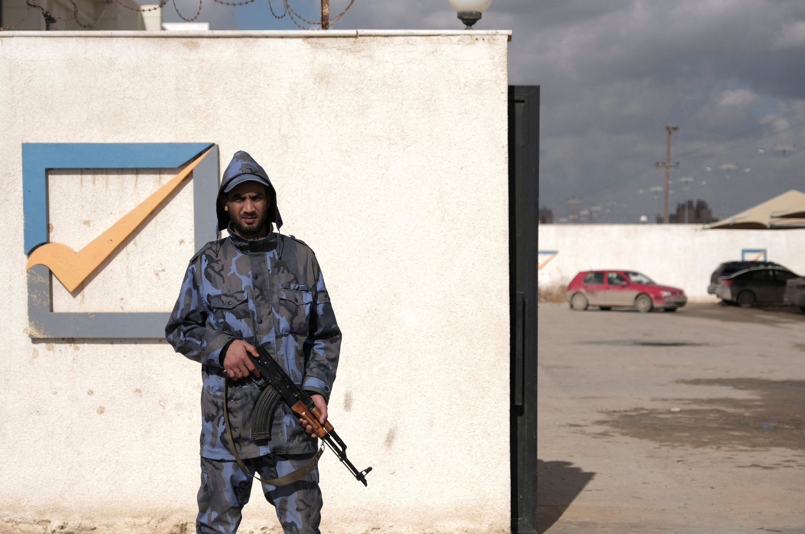 A security officer stands in front of the High National Election Commission building in Benghazi, Libya, Dec. 16, 2021. (REUTERS Photo)