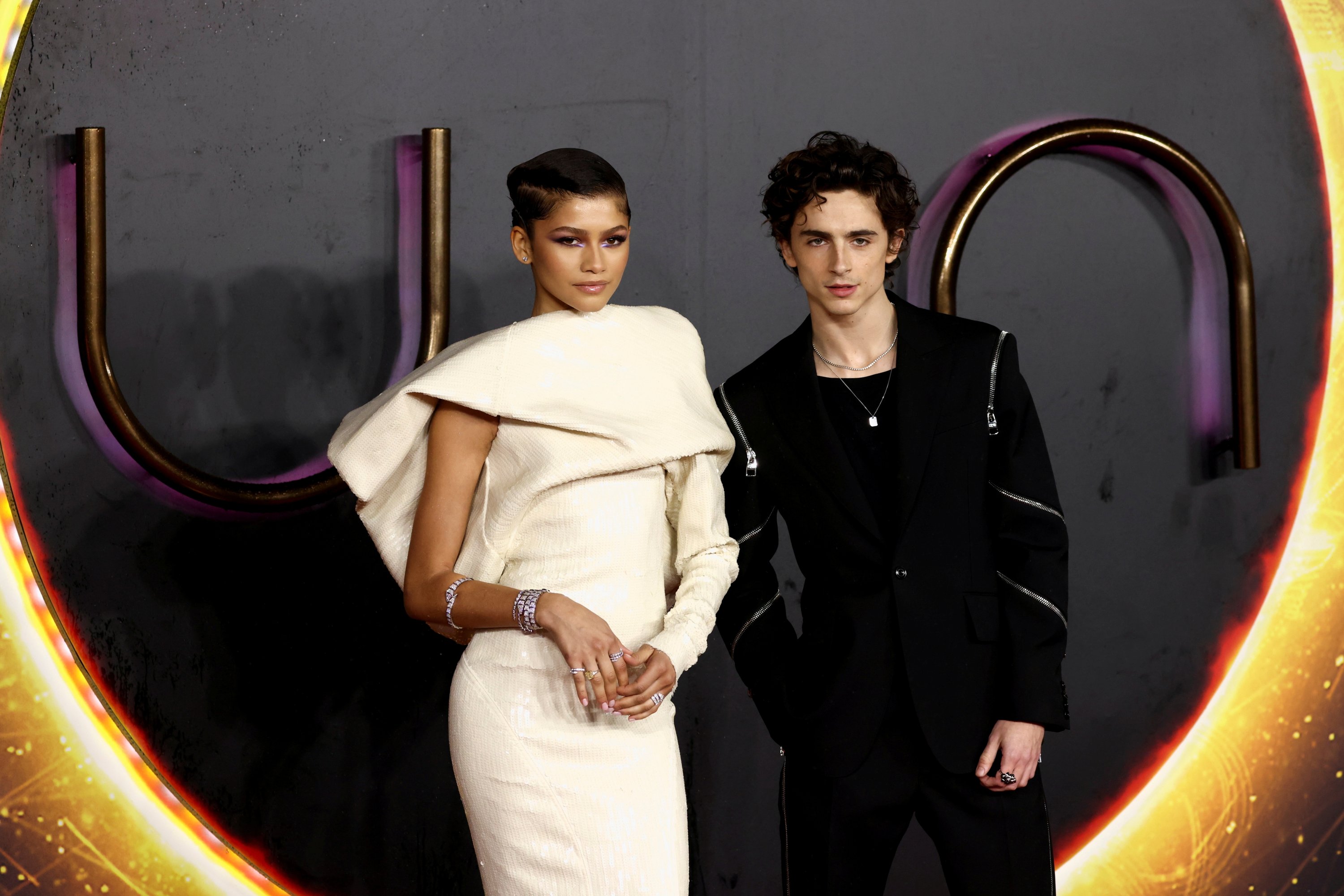 Cast members Zendaya and Timothee Chalamet pose as they arrive for a U.K. screening of the film 