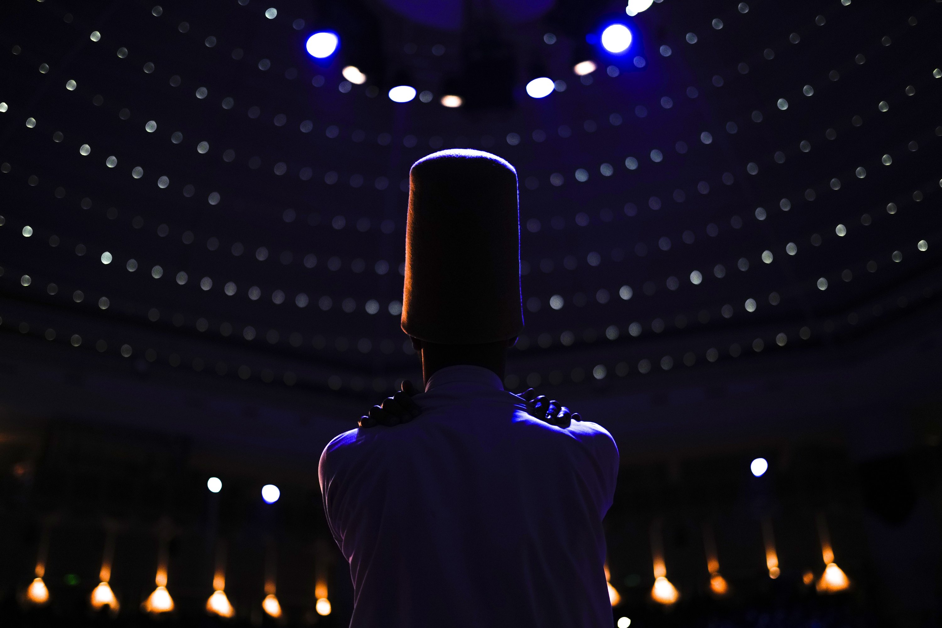 A whirling dervish of the Mevlevi Order performs during a Sheb-i Arus ceremony in Konya, central Turkey, Dec. 17, 2021. (AP Photo)