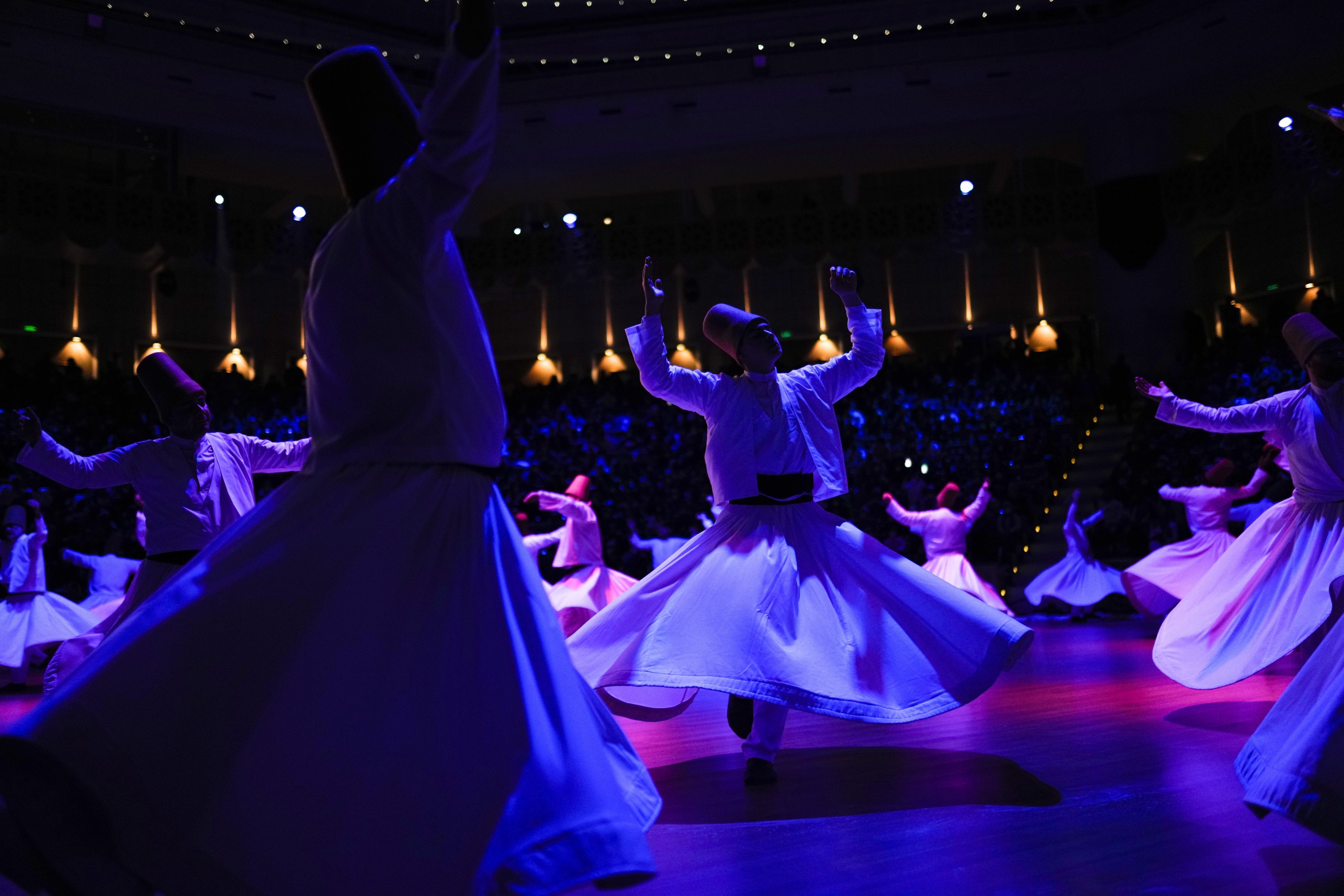 Whirling dervishes of the Mevlevi Order perform during a Sheb-i Arus ceremony in Konya, central Turkey, Dec. 17, 2021. (AP Photo)