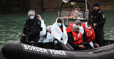 Migrants arrive at the Port of Dover on board a Border Force vessel after being rescued while crossing the English Channel, in Dover, Britain, Dec. 17, 2021. (Reuters Photo)