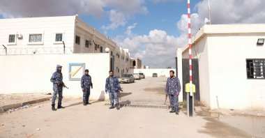 Security officers stand in front of the High National Election Commission building in Benghazi, Libya, Dec. 16, 2021. (REUTERS Photo)