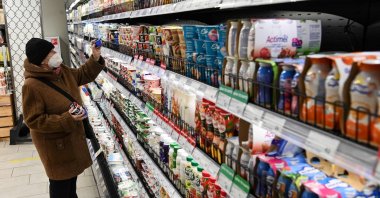 A person buys yogurt at a supermarket in Moscow, Russia, Dec. 15, 2021. (AFP Photo)