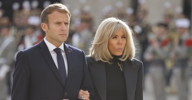 French President Emmanuel Macron (L) and his wife Brigitte Macron take part in the national memorial service for Hubert Germain, the last surviving Liberation companion at The Hotel des Invalides in Paris, France, Oct. 15 2021, (EPA-EFE Photo)