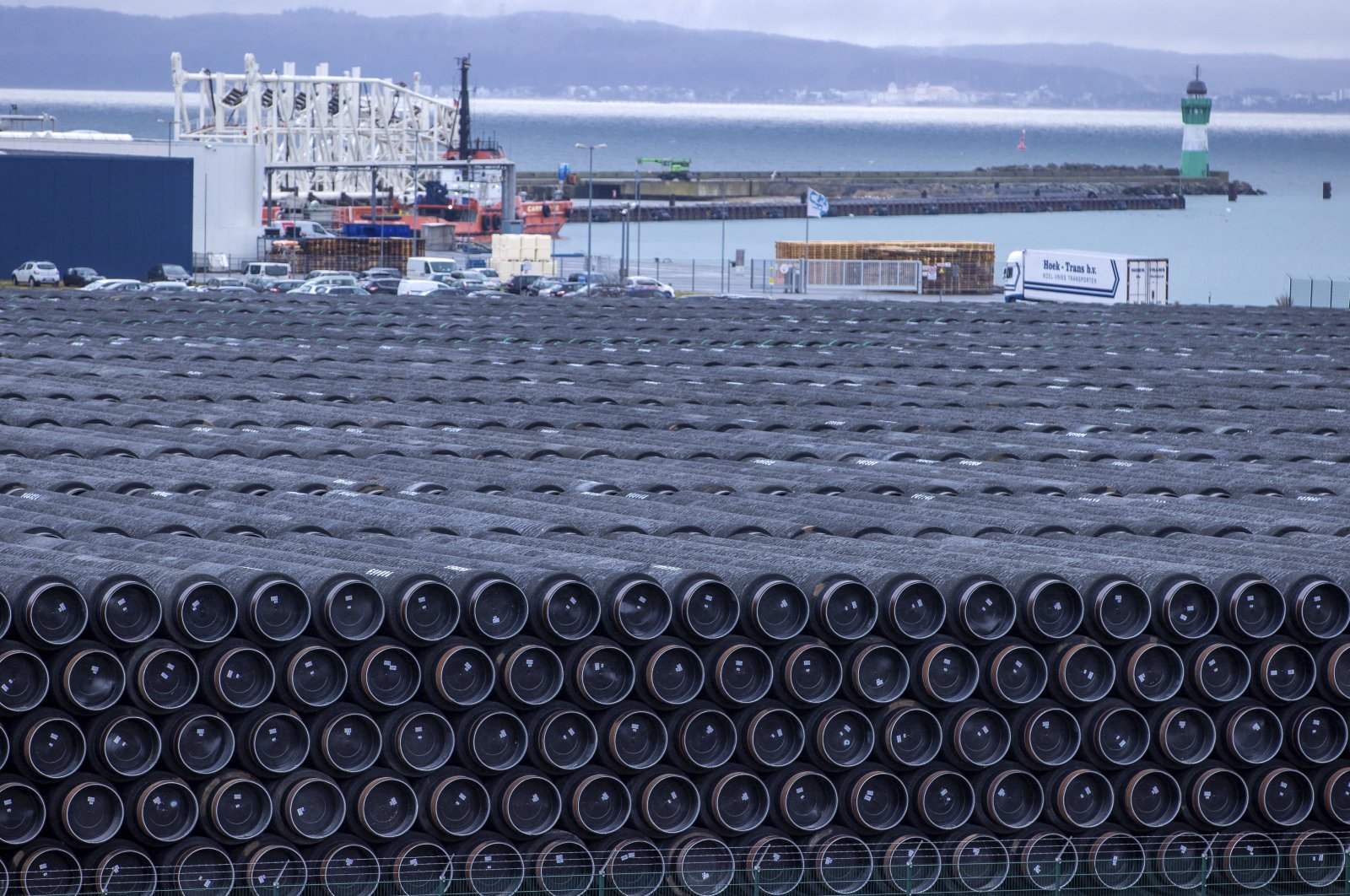 Pipes for the construction of the Nord Stream 2 natural gas pipeline from Russia to Germany and the Baltic Pipe from Denmark to Poland are stored at the port of Mukran in Sassnitz on the island of Ruegen, Germany, Jan. 6, 2021. (Photo via AP)