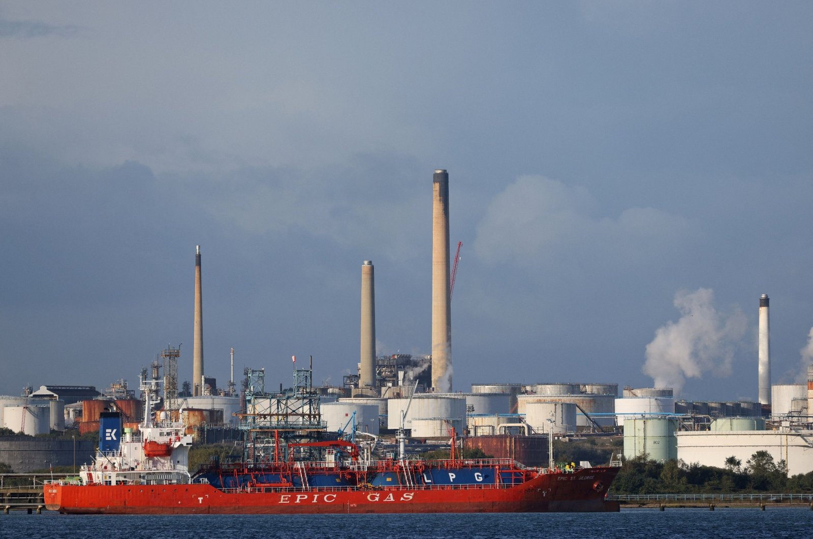 The MV Epic St George LNG (liquid natural gas tanker) passes the Esso Oil refinery in Fawley, near Southampton, southern England, Oct. 4, 2021. (AFP Photo)