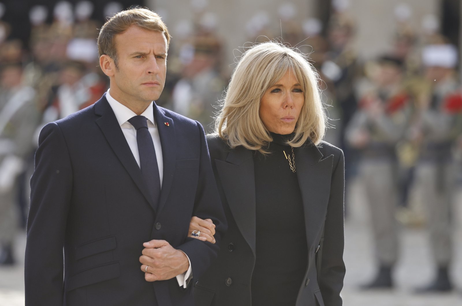 French President Emmanuel Macron (L) and his wife Brigitte Macron take part in the national memorial service for Hubert Germain, the last surviving Liberation companion at The Hotel des Invalides in Paris, France, Oct. 15 2021, (EPA-EFE Photo)