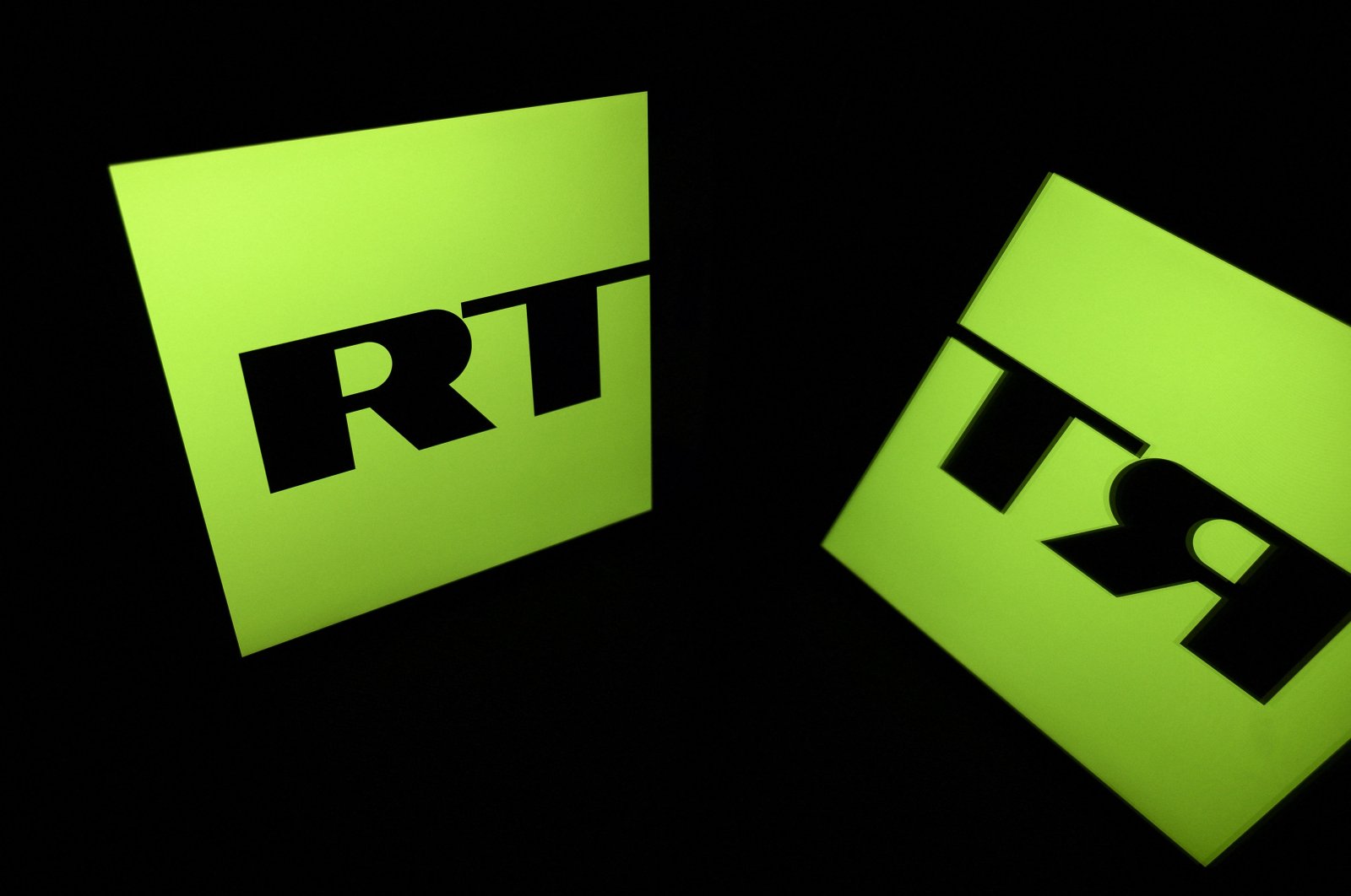 The logo of RT (Russia Today) TV channel displayed on a tablet, in Toulouse, southern France, Oct. 5, 2021. (AFP Photo)